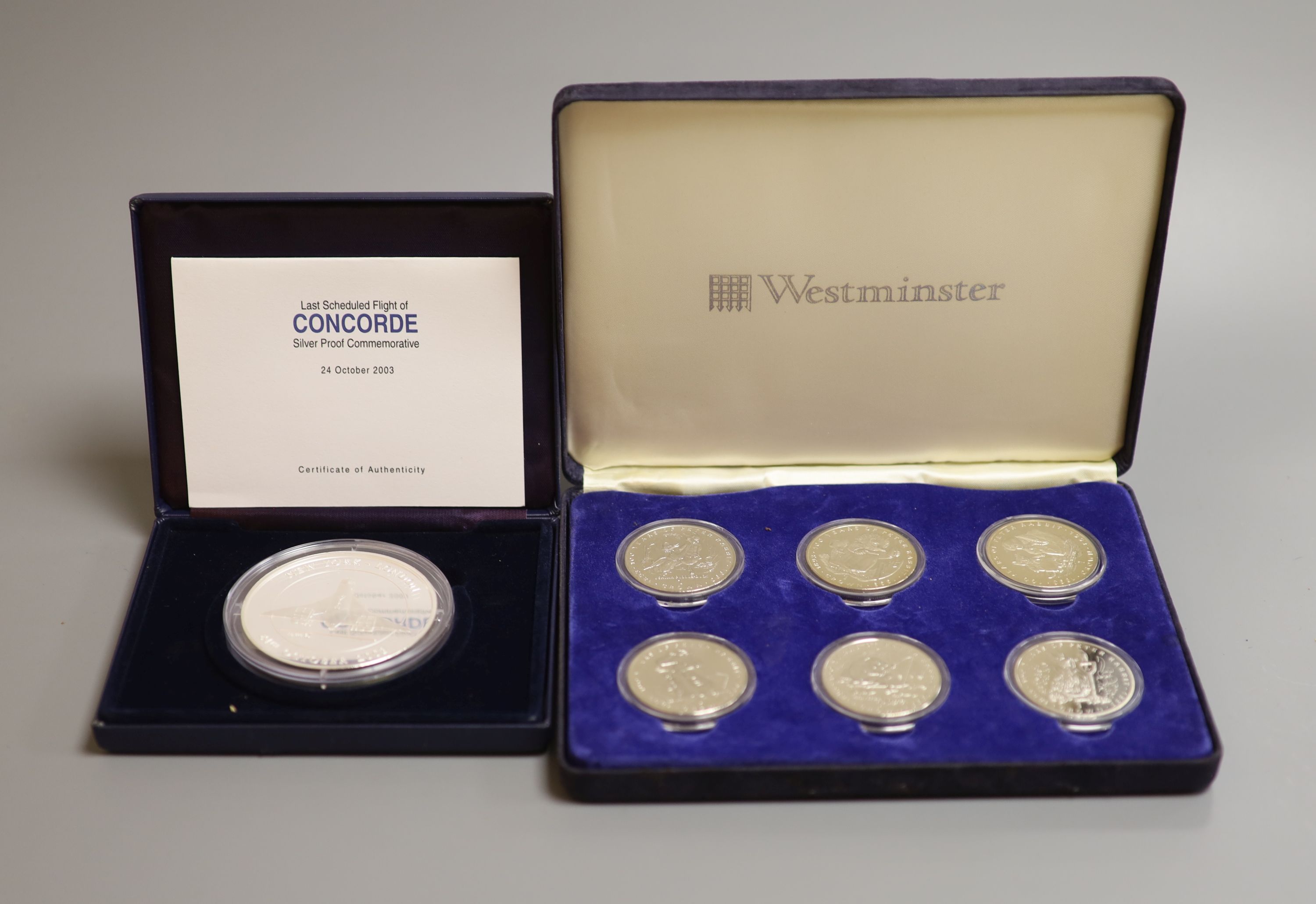A Westminster 5 oz. proof silver concorde commemorative coin, 2003 and A Westminster the Beatrix Potter coin collection comprising six crowns 1993